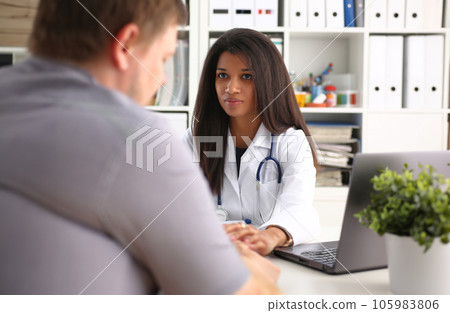 Friendly female doctor hold male patient 105983806