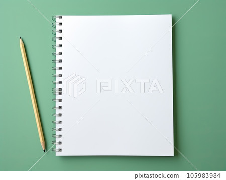 Top view blank paper Notebook and pencil. Desktop mock up, Flat lay of green working table background with office equipment, mockup greeting card. Top view blank paper Notebook and pencil. Desktop mock up, Flat lay of green working table background with office equipment, mockup greeting card. 105983984