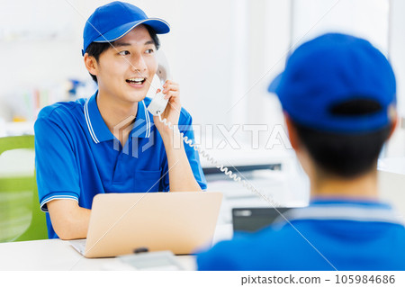 A driver wearing work clothes doing desk work in the office 105984686