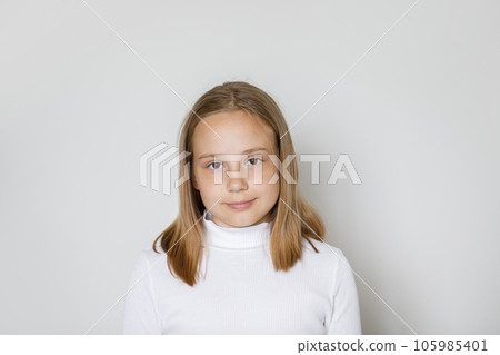 Attractive child girl with brown hair on white background. Kid 10 years old, studio portrait 105985401