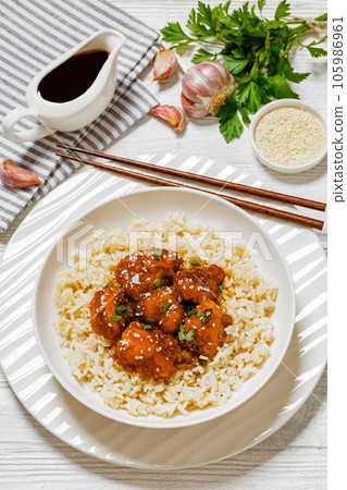 Baked Honey Sesame Chicken with brown rice 105986961