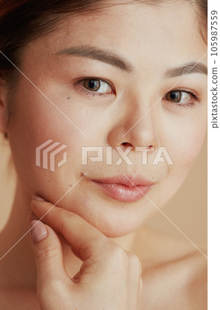 Portrait of young asian female looking in camera Portrait of young asian female looking in camera 105987559