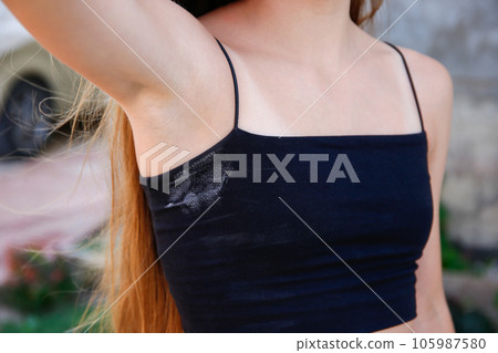 A white deodorant stain on a black t-shirt. A white deodorant stain on a black t-shirt. 105987580
