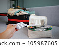 Summer beach accessories for your sea holiday and pills. Concept of medication required in journey. 105987605