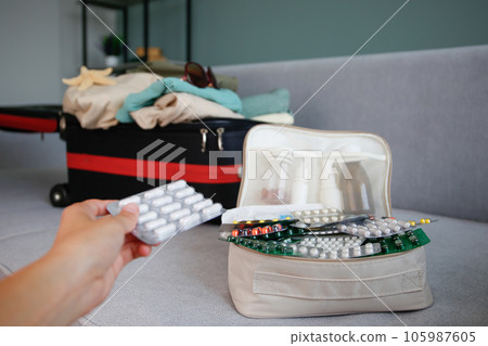 Summer beach accessories for your sea holiday and pills. Concept of medication required in journey. 105987605