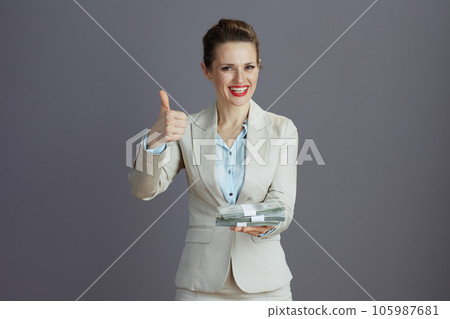 happy trendy female employee showing thumbs up happy trendy female employee showing thumbs up 105987681