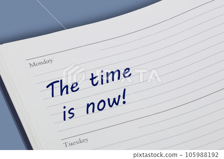 The time is now diary reminder open on desk 105988192