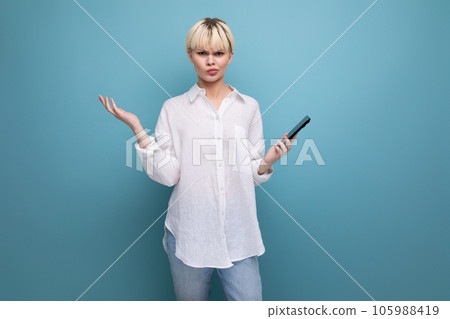 young charming pleasant pretty caucasian office worker woman with short blond hair is dressed in a 105988419