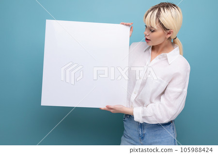 young pretty blond student woman dressed in a white blouse demonstrates her study project on a 105988424