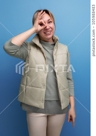 pretty young woman with white hair in a spring look smiling and friendly 105988483