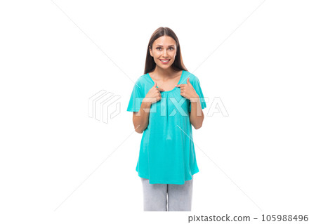 portrait of a pretty young caucasian brunette woman with long hair in a blue t-shirt on a white 105988496