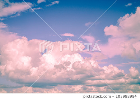 Beautiful fabulous pink cumulus clouds in the blue sky at sunset. natural background Beautiful fabulous pink cumulus clouds in the blue sky at sunset. natural background 105988984