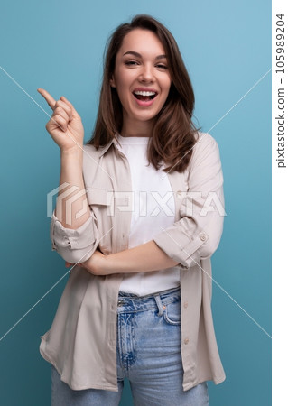 charming 30s woman with chic black well-groomed hair in a beige shirt charming 30s woman with chic black well-groomed hair in a beige shirt 105989204