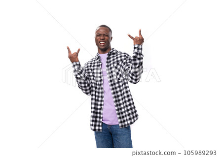 handsome young american man in a plaid shirt is actively moving 105989293