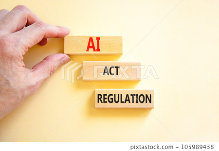 AI act regulation symbol. Concept words AI artificial intelligence act regulation on wooden block. Beautiful white background. Businessman hand. Business AI act regulation concept Copy space AI act regulation symbol. Concept words AI artificial intelligence act regulation on wooden block. Beautiful white background. Businessman hand. Business AI act regulation concept Copy space 105989438