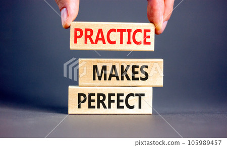 Practice makes perfect symbol. Concept words Practice makes perfect on wooden block. Beautiful grey table grey background. Businessman hand. Business practice makes perfect concept. Copy space. Practice makes perfect symbol. Concept words Practice makes perfect on wooden block. Beautiful grey table grey background. Businessman hand. Business practice makes perfect concept. Copy space. 105989457