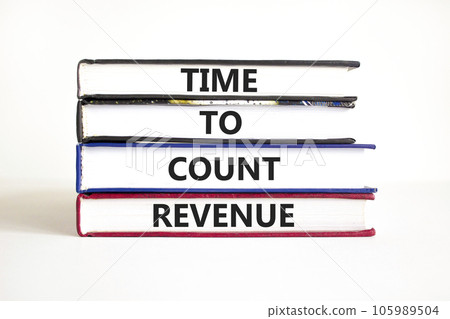 Time to count revenue symbol. Concept word Time to count revenue on books. Beautiful white table white background. Business and time to count revenue concept. Copy space. Time to count revenue symbol. Concept word Time to count revenue on books. Beautiful white table white background. Business and time to count revenue concept. Copy space. 105989504