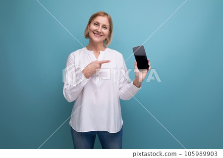 40s blonde hair woman with phone mockup on studio background with copy space 40s blonde hair woman with phone mockup on studio background with copy space 105989903