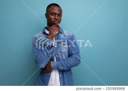 portrait of a young handsome with dark skin american guy dressed stylishly in casual clothes on a 105989906