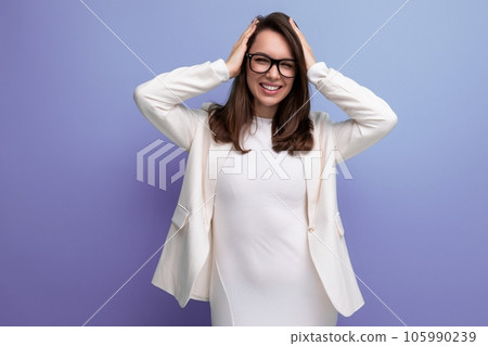 confident young brunette woman in white dress confident young brunette woman in white dress 105990239