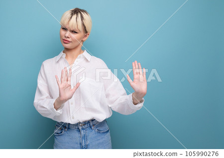 young caucasian woman with short haircut wearing a white shirt refusing an offer young caucasian woman with short haircut wearing a white shirt refusing an offer 105990276