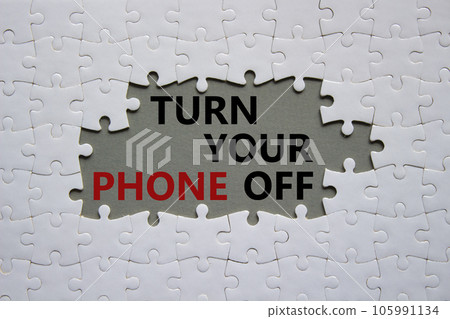 Turn Your Phone off symbol. White puzzle with words Turn Your Phone off. Beautiful grey background. Business concept. Copy space. 105991134