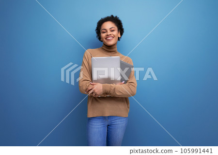 isolated background, cute young brunette hispanic woman freelancer holding laptop isolated background, cute young brunette hispanic woman freelancer holding laptop 105991441