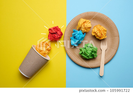Concept of inspiration with new ideas, the search for creative solutions, crumpled sheets of paper in the form of balls on a blue yellow background 105991722