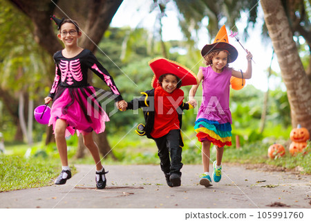 Kids trick or treat. Halloween fun for children. 105991760