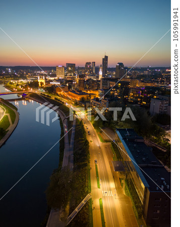 Night view of lit-up downtown Vilnius with skyscrapers. Vertical shot Night view of lit-up downtown Vilnius with skyscrapers. Vertical shot 105991941