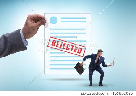Man receiving rejection notice on his cv Man receiving rejection notice on his cv 105992080