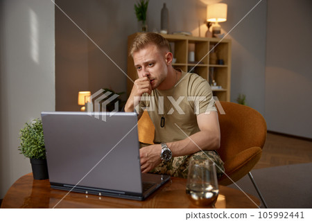 Online consultation of military man with psychiatrist. 105992441