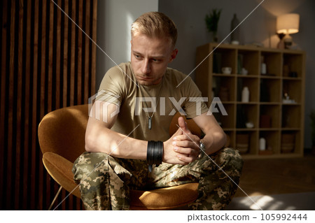 Portrait of military man being deep in thoughts feeling sorrowful 105992444