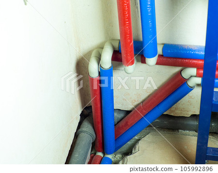 Portrait of worker or engineer in blue work clothes and yellow safety helmet 105992896