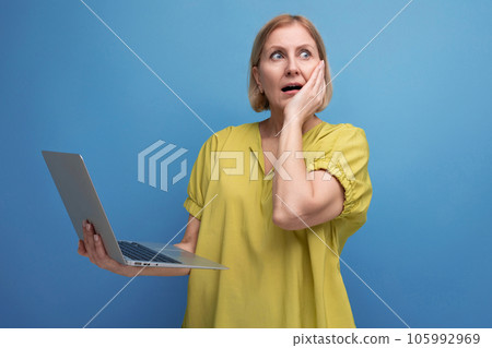pensive middle aged business woman freelancing using laptop and internet connection 105992969