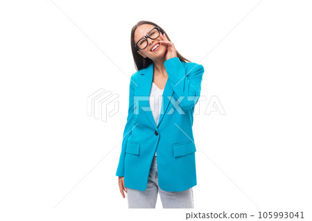 young brunette woman secretary in a blue elegant jacket on a white background with copy space young brunette woman secretary in a blue elegant jacket on a white background with copy space 105993041