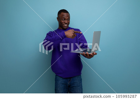 handsome young freelancer male living in america with laptop 105993287