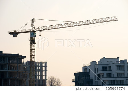 Tower cranes and high residential apartment buildings under construction. Real estate development. 105993774