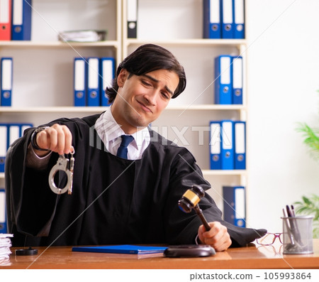 Young handsome judge working in court 105993864