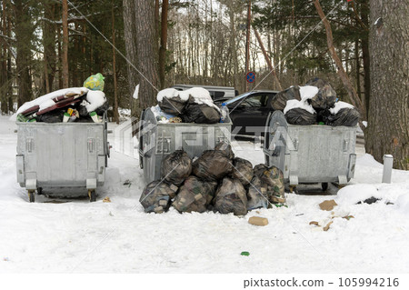 overflowing garbage containers on the site around which garbage 105994216