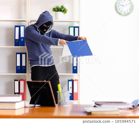 Male thief in balaclava in the office Male thief in balaclava in the office 105994571
