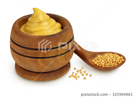 Mustard sauce in wooden bowl with seed isolated on white background Mustard sauce in wooden bowl with seed isolated on white background 105994661