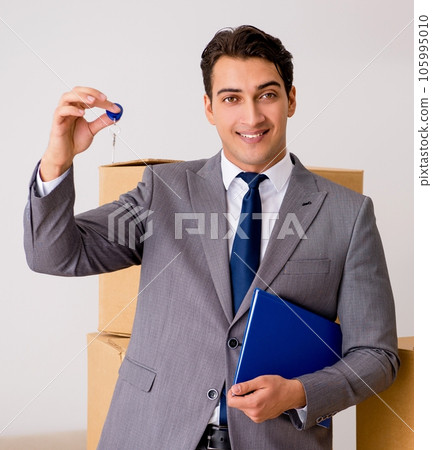 Real estate agent with key from new house Real estate agent with key from new house 105995010