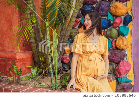 A strong and resilient woman over 40 embraces the beauty of childbirth in Mexico, celebrating the journey of motherhood with cultural richness A strong and resilient woman over 40 embraces the beauty of childbirth in Mexico, celebrating the journey of motherhood with cultural richness 105995646