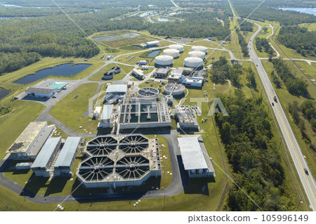 Aerial view of water treatment factory at city wastewater cleaning facility. Purification process of removing undesirable chemicals, suspended solids and gases from contaminated liquid Aerial view of water treatment factory at city wastewater cleaning facility. Purification process of removing undesirable chemicals, suspended solids and gases from contaminated liquid 105996149