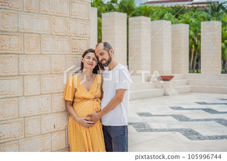 A loving couple in their 40s cherishing the miracle of childbirth in Mexico, embracing the journey of parenthood with joy and anticipation A loving couple in their 40s cherishing the miracle of childbirth in Mexico, embracing the journey of parenthood with joy and anticipation 105996744