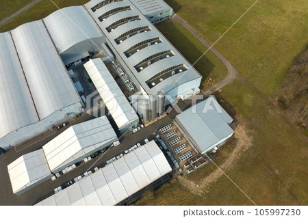 Aerial view of modern factory structure for production and distribution of industrial equipment. Concept of global industry Aerial view of modern factory structure for production and distribution of industrial equipment. Concept of global industry 105997230