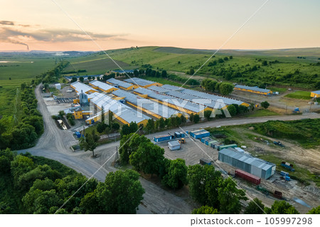 Aerial view of industrial ventilated silos for long term storage of grain and oilseed. Metal elevator for wheat drying in agricultural zone 105997298