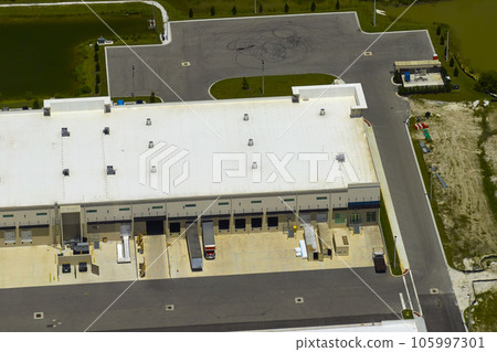 Aerial view of industrial park with goods warehouses and logistics centers in city zone from above Aerial view of industrial park with goods warehouses and logistics centers in city zone from above 105997301