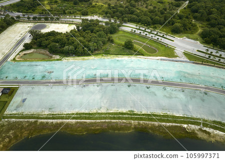 Aerial view of construction site with new tightly packed homes in Florida closed living clubs. Family houses as example of real estate development in american suburbs 105997371